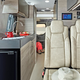 The inside of the Jaco van has seating, cabinets and a small kitchen